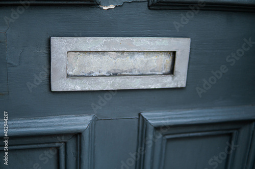 Obraz na płótnie Old letterbox in the door, traditional way of delivering letters to the house, old mailbox, correspondence
w salonie