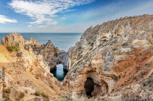 Cliffs and rocky caverns in Ponta da Piedade, Lagos - Algarve, Portugal. Beautifull cliffs at sunset in the Algarve photo