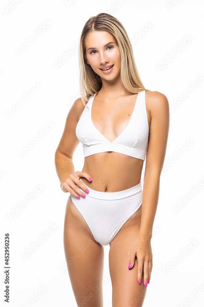 Slim tanned woman body over white background