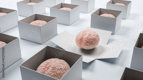 Thinking outside the box - concept shot. Some human brains in a box and one box opened up. Creativity, innovation, inspiration concepts. photo