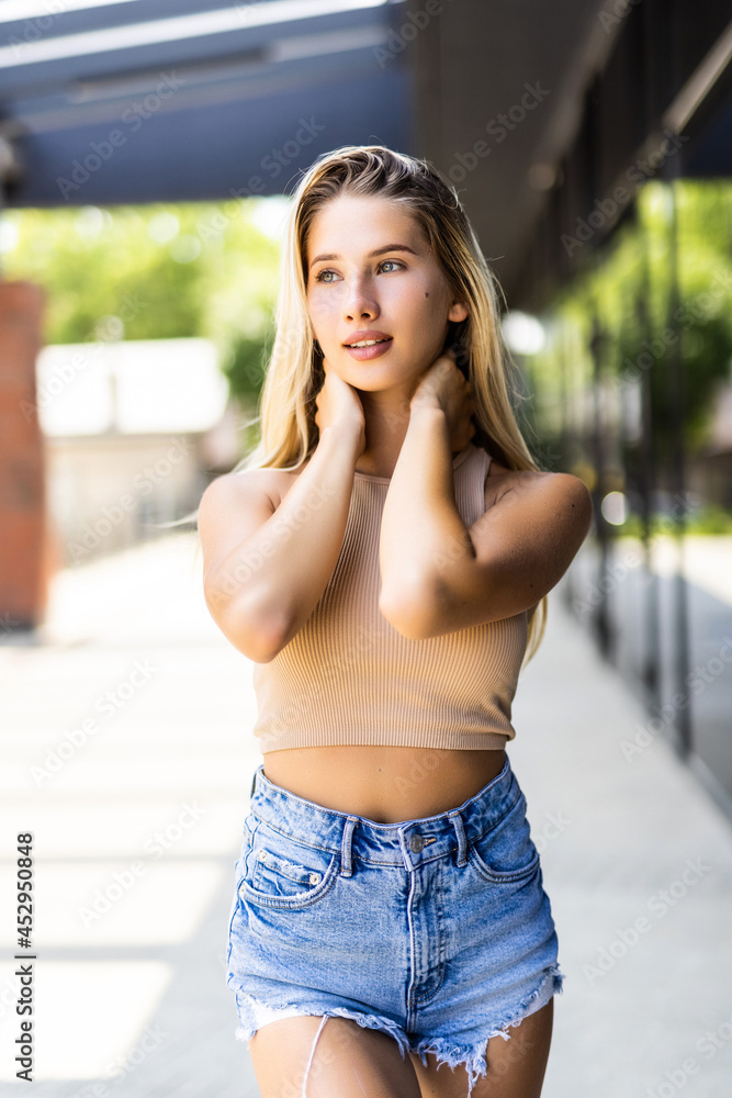 Portrait of smiling woman on the background of the city