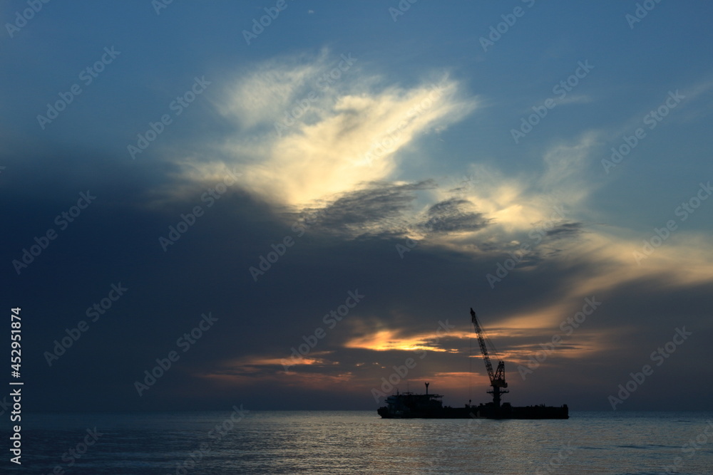 silhouette, big boat and beautiful sunrise nature