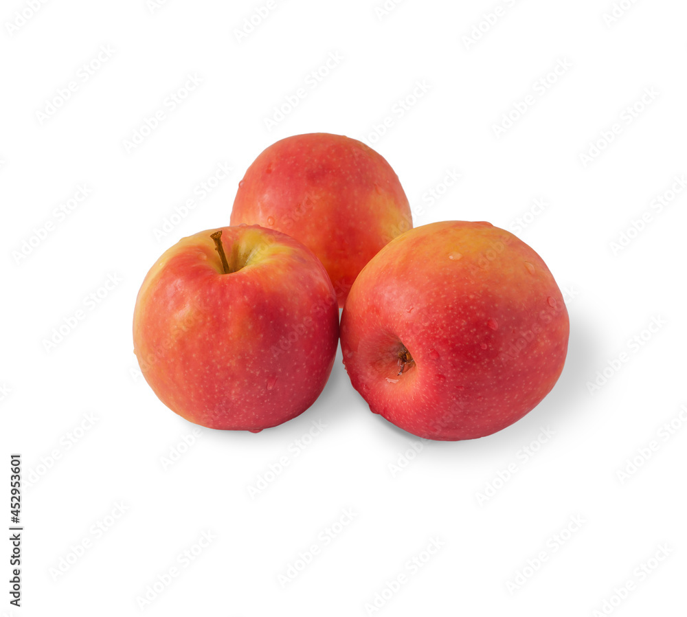 Three red ripe apples with water droplets isolated on a white background. Three red ripe apples with water droplets isolated on a white background.