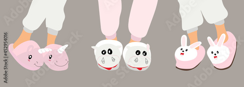 Children in pajamas with funny slippers. Cute animal slippers. Home footwear slippers. Pajama party.
