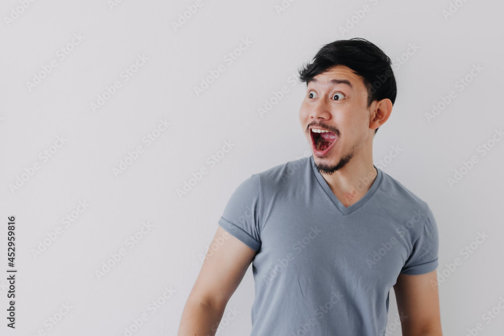 Obraz premium Shocked and surprised face of Asian man in isolated on white background.