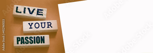 Live your passion words written on wooden blocks. live your dream predestination self motivation coaching concept
