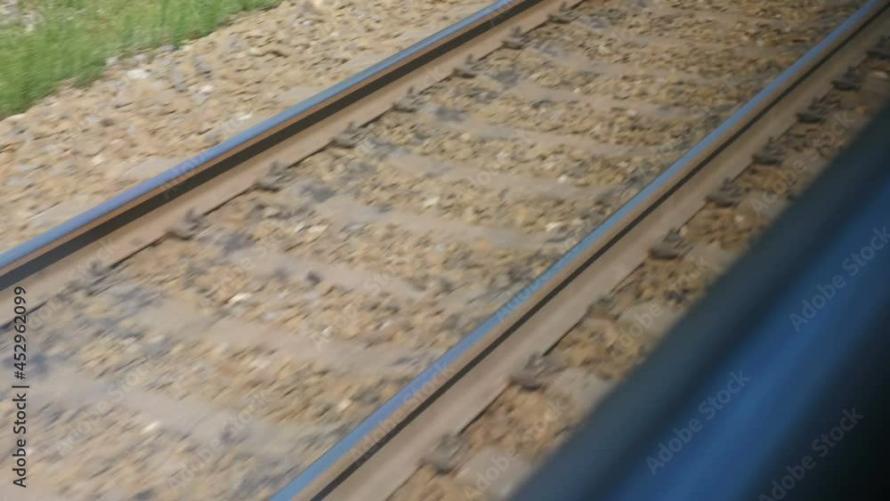 View from train window on railroad track. Train journey point of view from passenger. Rails and sleepers moving fast. 4 k video View from train window on railroad track. Train journey point of view from passenger. Rails and sleepers moving fast. 4 k video