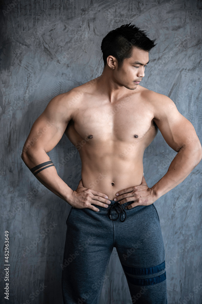 Portrait of asian man big muscle at the gym,Thailand people,Workout for good healthy,Body weight training,Fitness at the gym concept