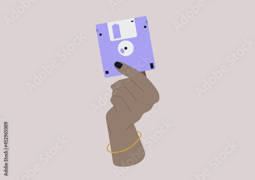 Wallpaper Mural A hand holding a floppy disc, old technology symbol, flat vector illustration Torontodigital.ca