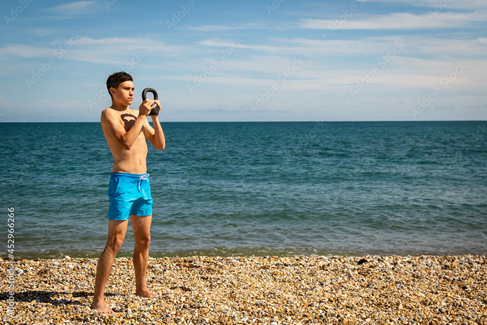 Exercising with a kettlebell weight Exercising with a kettlebell weight