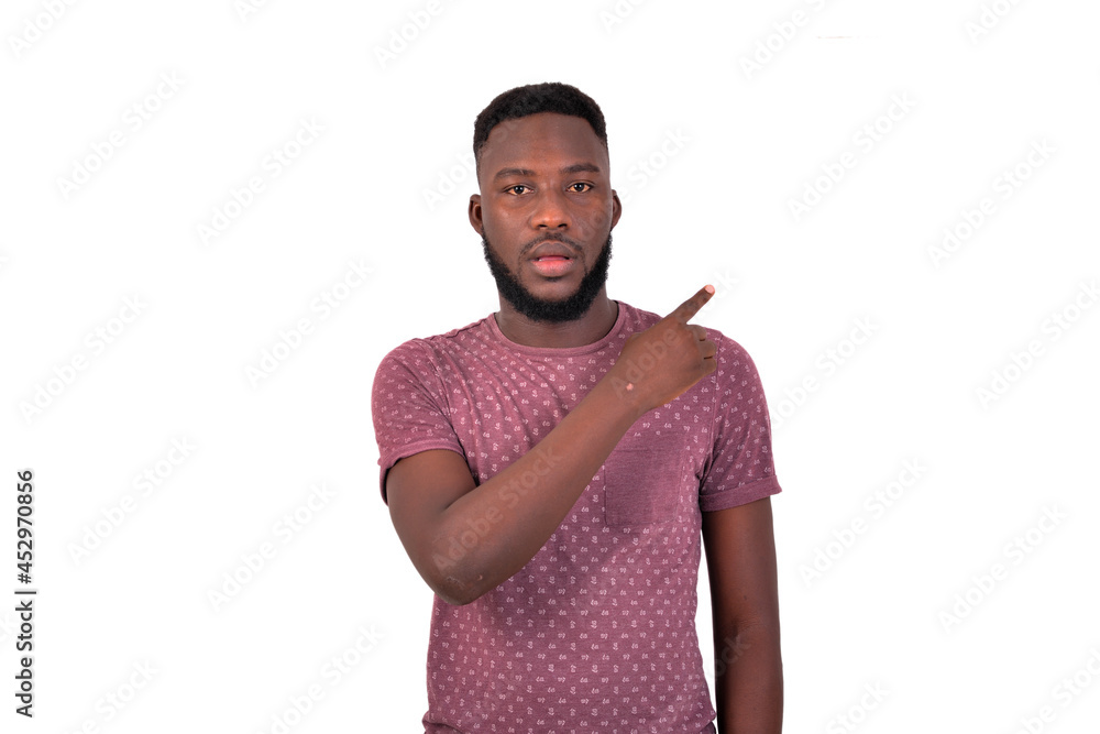 handsome young man pointing finger aside. handsome young man pointing finger aside.