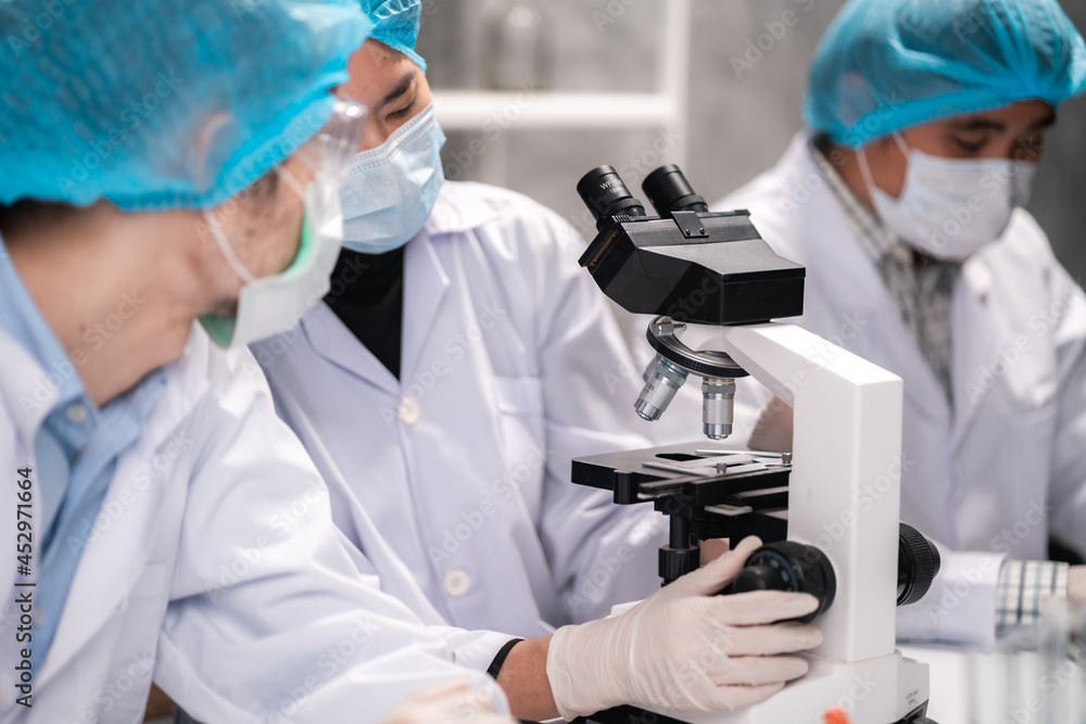 Health care researchers working in life science laboratory, medical science technology research work for test a vaccine, coronavirus covid-19 vaccine protection cure treatment Health care researchers working in life science laboratory, medical science technology research work for test a vaccine, coronavirus covid-19 vaccine protection cure treatment