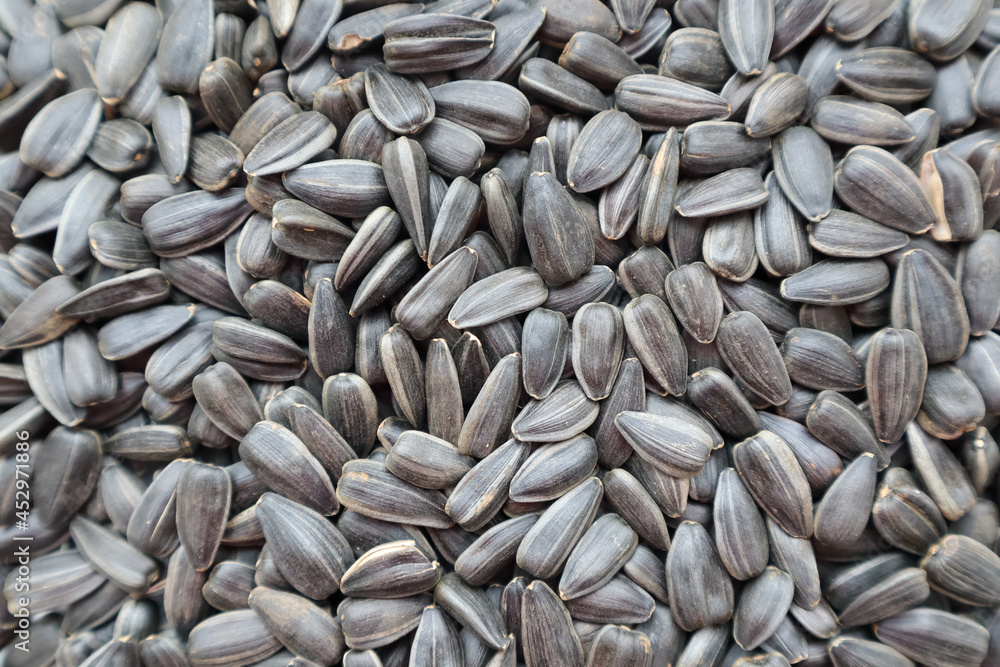 background of black sunflower seeds close up background of black sunflower seeds close up