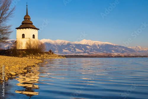 Church of Virgin Mary in Havranok and lake Liptovska Mara, district Liptovsky...