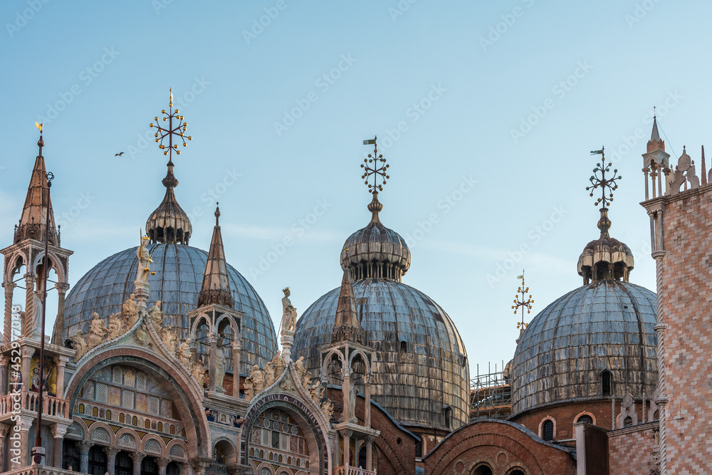 Domes of the Basilica of San Marco close up in an early summer morning, Venice. Italy.