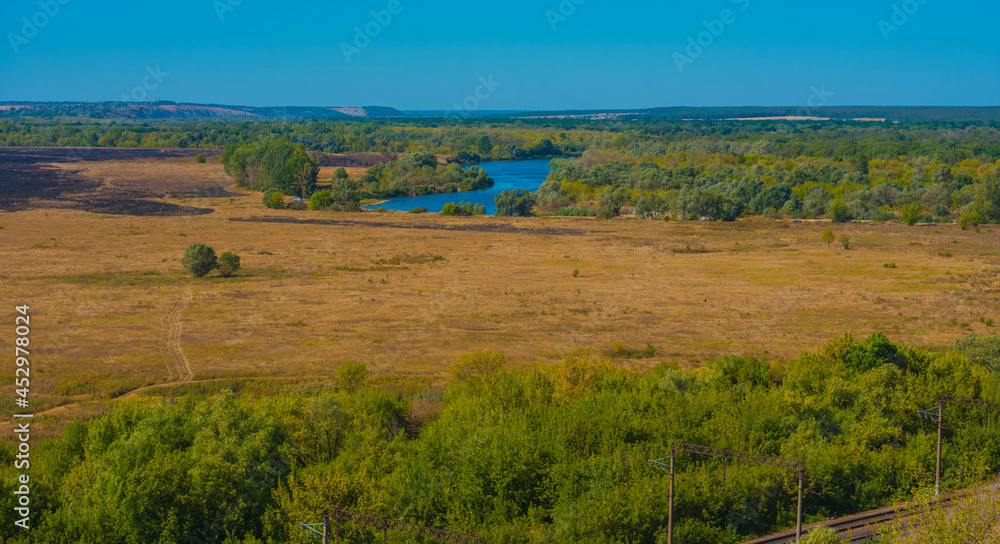 summer landscape, field and bend of the  river
