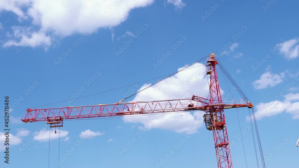 Construction jib crane tower at construction site of new residential building Construction jib crane tower at construction site of new residential building