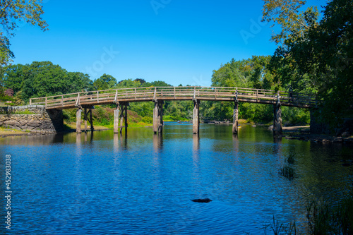 Old North Bridge and Memorial obelisk in Minute Man National Historical Park, Concord, Massachusetts MA, USA.