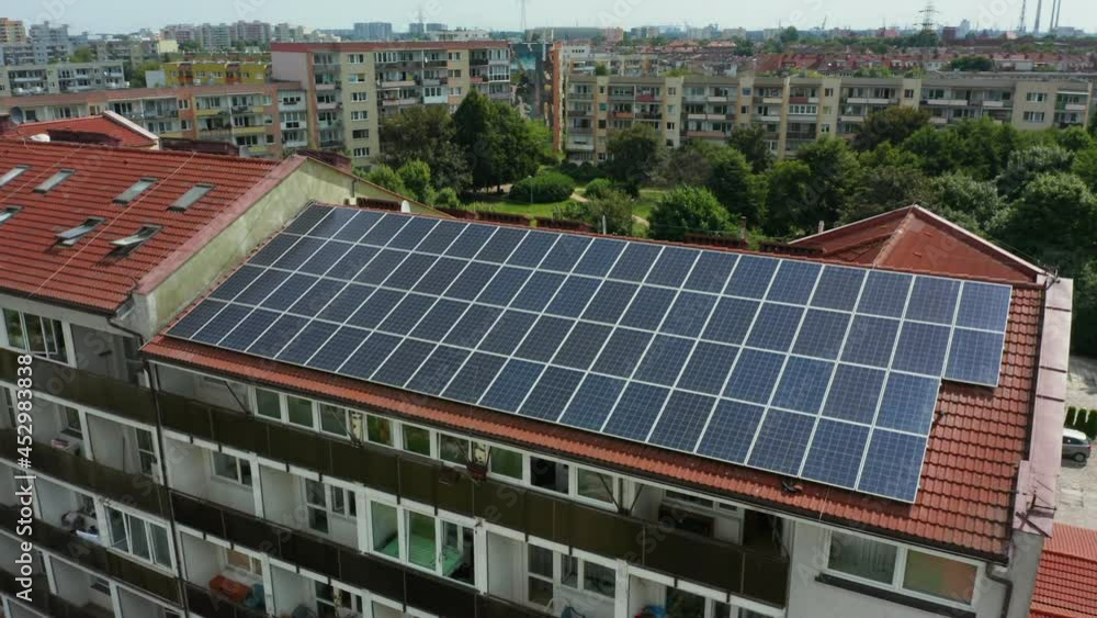 Aerial view of the farm of solar panels installed on the roof of an office building. Farm of solar panels. Concept of electricity, ecology, technologies. Aerial view of the farm of solar panels installed on the roof of an office building. Farm of solar panels. Concept of electricity, ecology, technologies.
