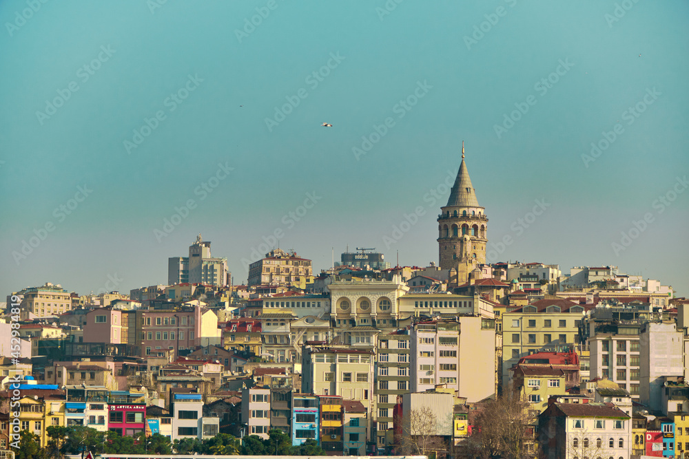 Turkey istanbul 04.03.2021. Famous galata tower of istanbul taken photo from istanbul bosporus. it is established by genoese sailors for watching of bosporus of constantinople.