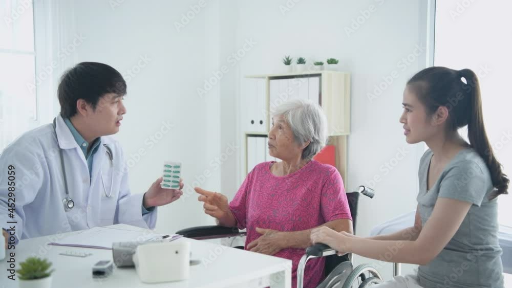 Medical concept of 4k Resolution. A doctor is explaining the medication to a patient in the hospital room. Medical concept of 4k Resolution. A doctor is explaining the medication to a patient in the hospital room.