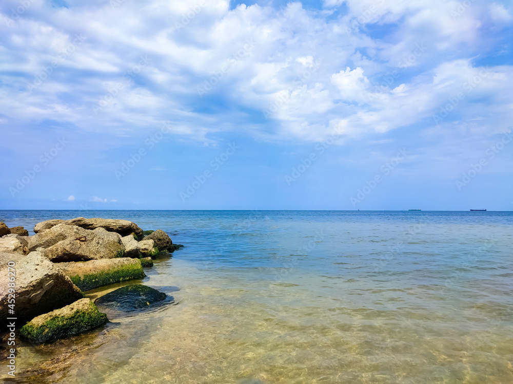 Beautiful panoramic view of the sea and the blue sky. The sea coast.