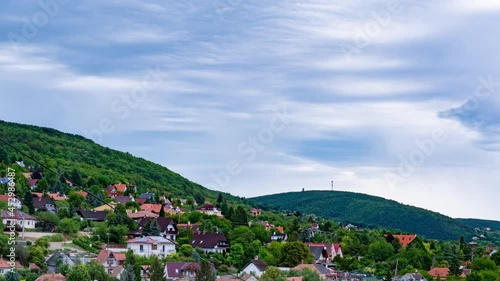 Time-lapse view on the clouds and the hills in Balatonfured, Hungary on a sunny day.