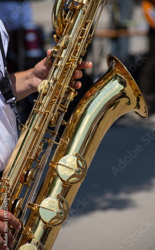 playing a brass instrument. military band performs at the festival