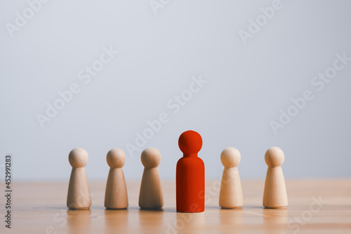 concept Business   HR for leadership and team leader  row of wooden dolls standing on wood table that one Different and stand out from the group