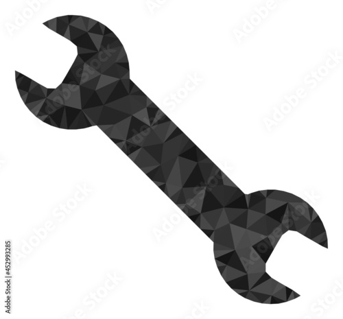 Low-poly spanner tool combined with randomized filled triangles. Triangle spanner tool polygonal symbol illustration. Spanner Tool icon is filled with triangles.