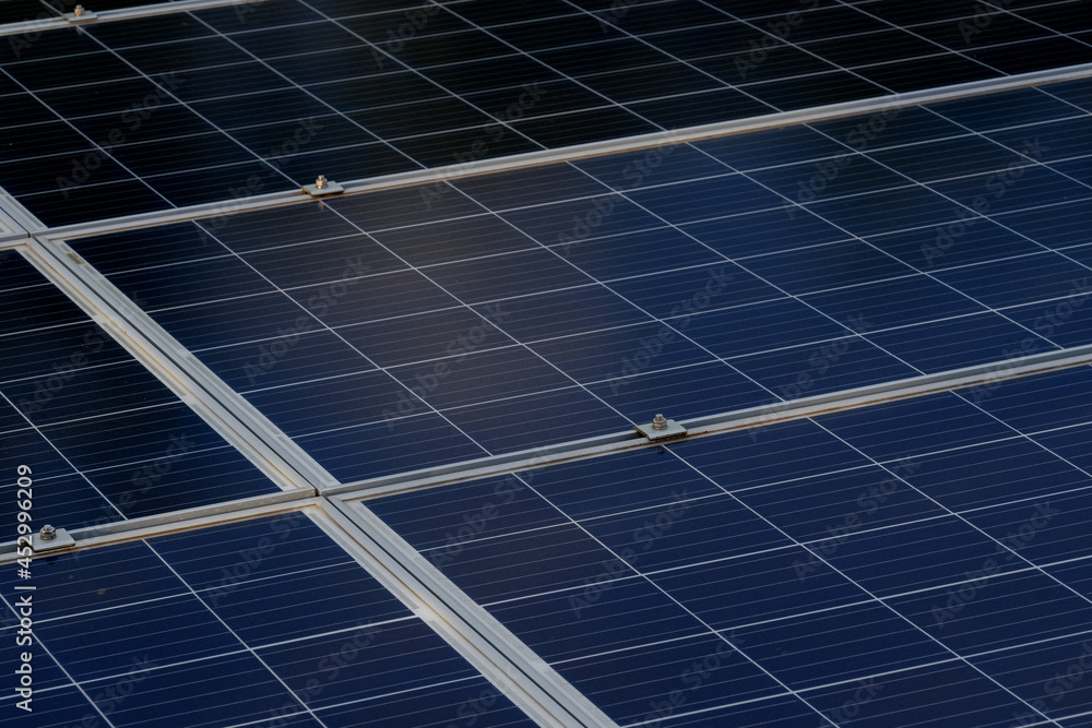 Solar panels on the plot near the house, Arrangement of solar energy production plant Solar panels on the plot near the house, Arrangement of solar energy production plant