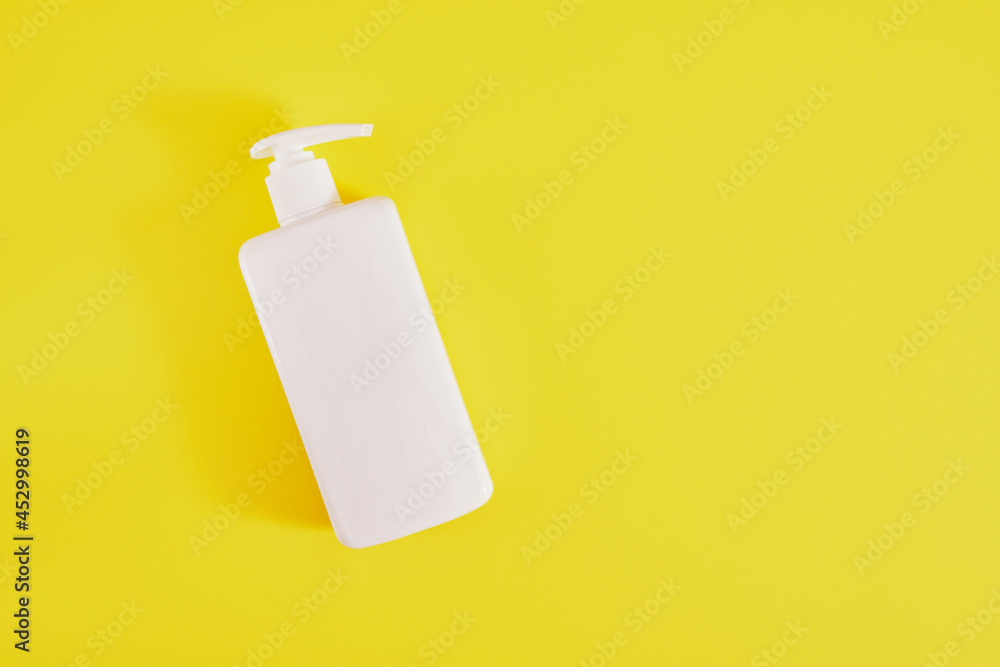 Bottle of liquid soap, white plastic flacon with dispenser on a yellow  background. Copy space, Stock Photo | Adobe Stock