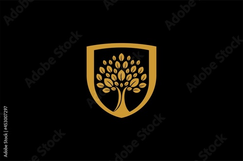Hand tree logo design vector. Plant care illustration sign. Green leaf in shield vector icons.
