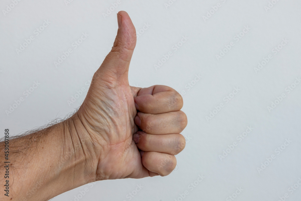 man hand making thumbs up