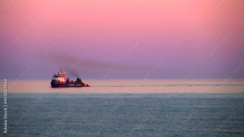 Lockdown Beautiful Shot Of Steam From Ship Moored In Sea Against Pink Sky During Sunset - Cadiz, Spain Lockdown Beautiful Shot Of Steam From Ship Moored In Sea Against Pink Sky During Sunset - Cadiz, Spain