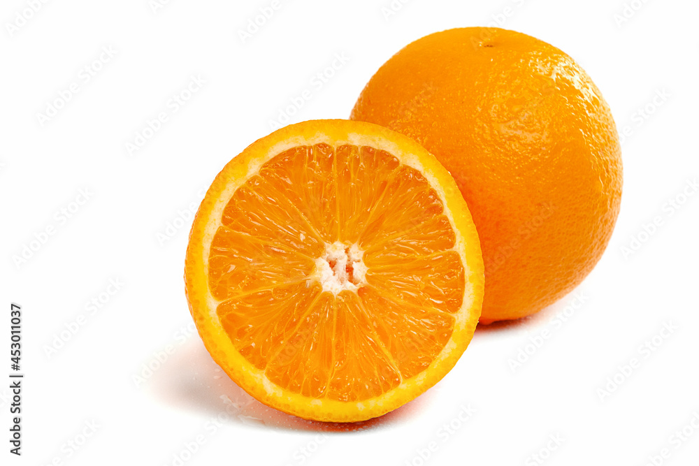 Fototapeta premium Orange close-up on a white background, cut and whole