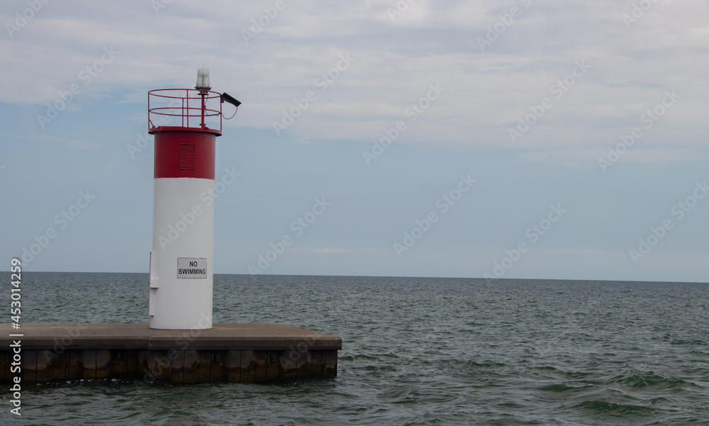 Lighthouse aquatic beacon on the shores of lake erie