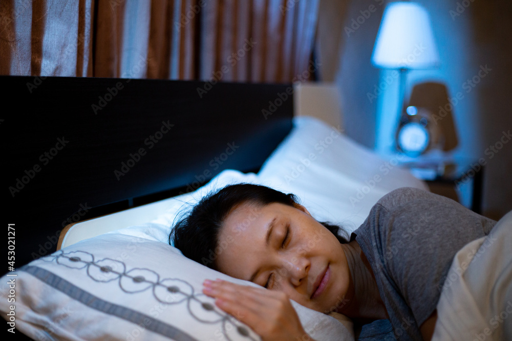 Asian woman good sleeping and relaxing on the bed.Leisure adult malaysian girl Asian woman good sleeping and relaxing on the bed.Leisure adult malaysian girl