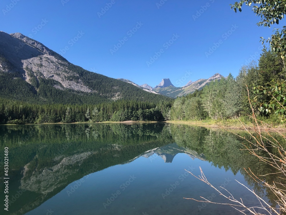 Wedge Pond in Kananaskis Country, Alberta, Canada. Popular alpine hiking, camping, and fishing destination near Calgary. Perfect reflection of mountains in the lake. 