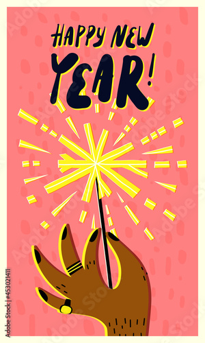 A man's hand with black nails design, rings, holding a burning Bengal fire, firework sparkler. Happy New Year card.