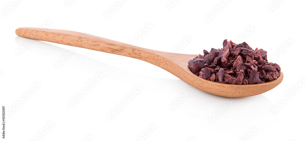 dried cocoa beans in wooden spool white background dried cocoa beans in wooden spool white background