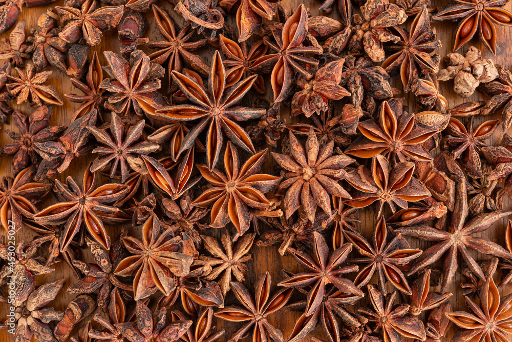 Anise stars on wooden for background, top view. Anise stars on wooden for background, top view.