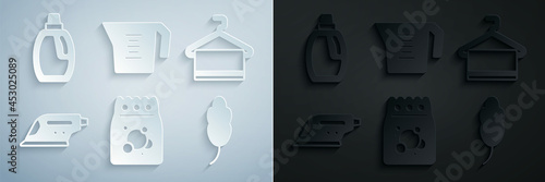 Set Laundry detergent, Towel on hanger, Electric iron, Feather, Measuring cup and Bottle for cleaning agent icon. Vector