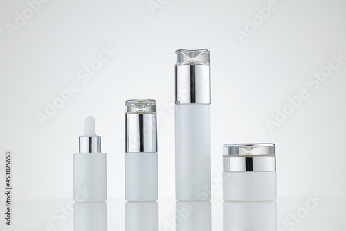 White cosmetic bottle on white background. Blank label used for design
