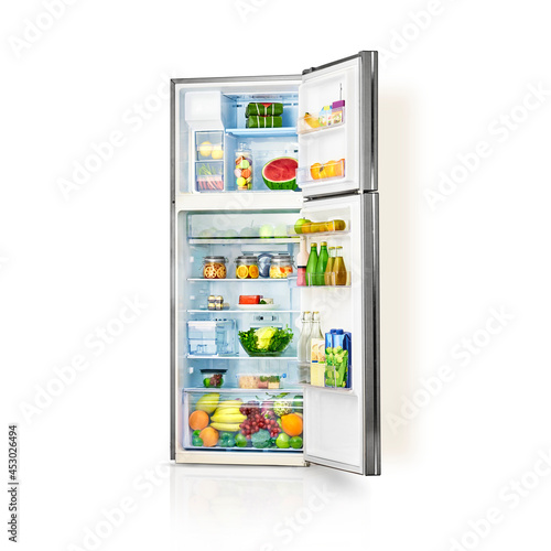 Refrigerator full of food isolated on white background