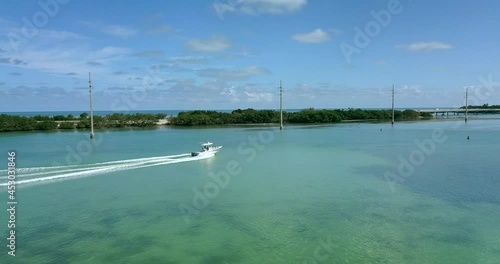 Drone Shot of boat cruising along US-1 approaching Robbie's Marina in Islamorada, Florida Keys photo