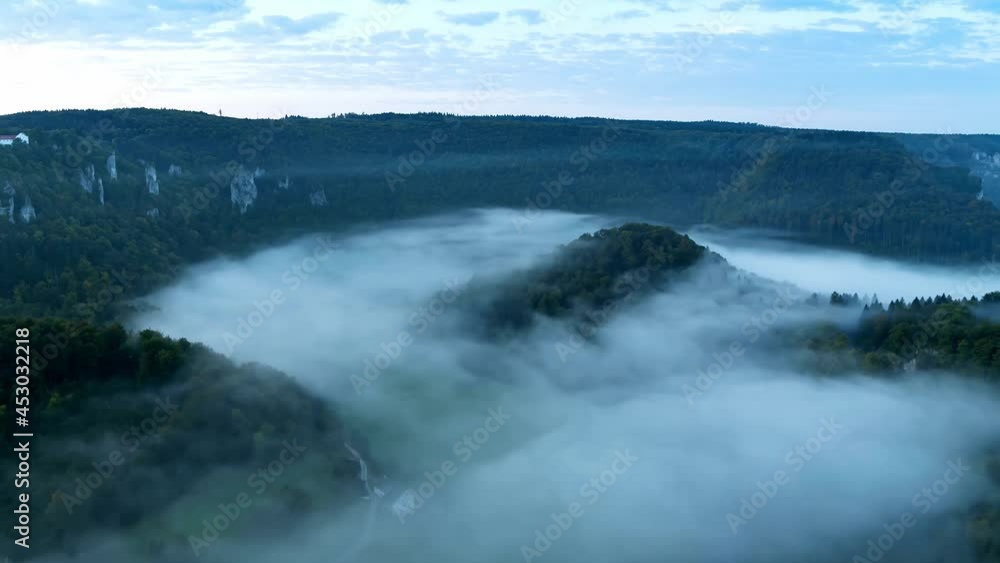 White clouds flow in the sky and mist flows between mountains, time lapse White clouds flow in the sky and mist flows between mountains, time lapse