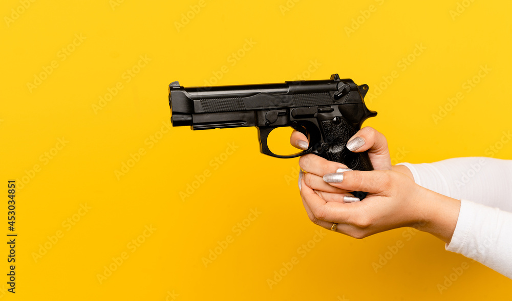Practice Using A Gun For Self defense Asian Woman s Hand And The Guns practice-using-a-gun-for-self-defense-asian-woman-s-hand-and-the-guns