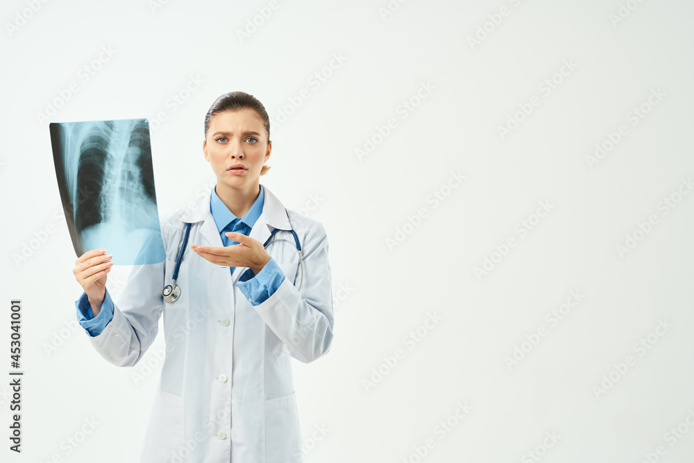 radiologist with x-ray health care light background radiologist with x-ray health care light background