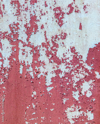 Old painted cracked wall as an abstract background.